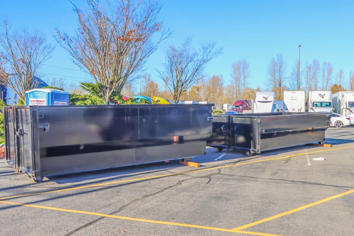 Professional dumpster rental service with roll-off container on residential driveway in Ocala